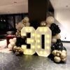 30 marquee numbers and balloon garland in beige black and gold