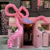 Large pink balloon bow