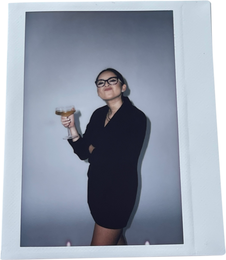 Elly of Pastelly pouring a drink, polaroid frame