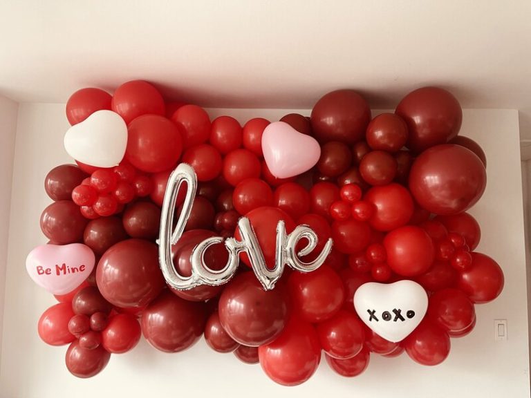 Red and pink balloon garland spelling love